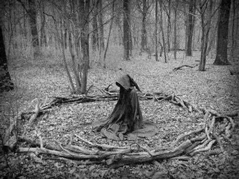 Witch casting spells in the woods